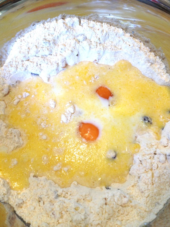 Adding in the wet ingredients (melted butter, milk, eggs)